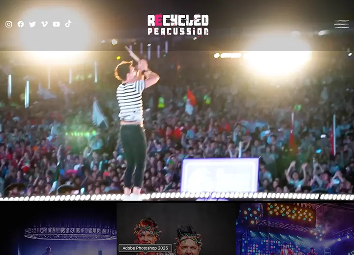 Recycled Percussion home page with a performer in front of a large crowd